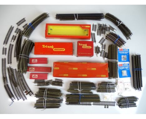 OO SCALE MODEL RAILWAYS: A large crate of track by TRI-ANG and HORNBY DUBLO together with some accessories and an empty coach