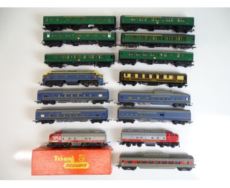 OO SCALE MODEL RAILWAYS: A quantity of mostly unboxed TRI-ANG rolling stock to include Trans-Continental locos and coaches - 