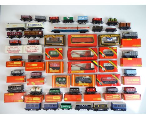 OO SCALE MODEL RAILWAYS: A large quantity of boxed and unboxed wagons by HORNBY and others - as lotted - Generally G in F/G b