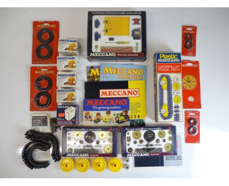 VINTAGE TOYS: MECCANO - A selection of motors, tracks, gear kits and other parts as lotted, all old shop stock - VG/E in G/VG