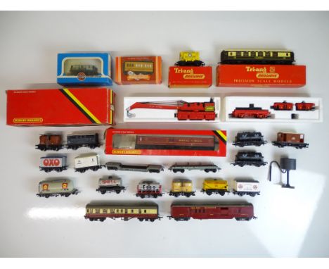 OO SCALE MODEL RAILWAYS: A quantity of wagons and coaches by TRI-ANG, HORNBY and others - as lotted - F/VG in F/G boxes (wher