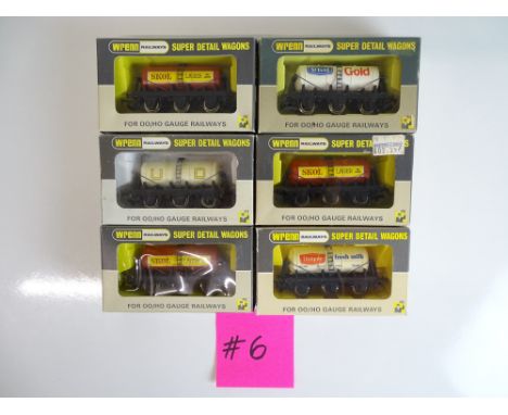 OO SCALE MODEL RAILWAYS: A mixed group of WRENN 6 wheel tank wagons including rarer Unigate and St Ivel's Gold examples - VG 