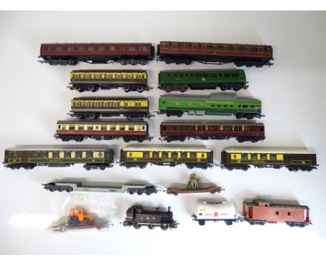 OO SCALE MODEL RAILWAYS: A quantity of unboxed rolling stock by TRI-ANG, AIRFIX and others to include a tank loco, wagons and