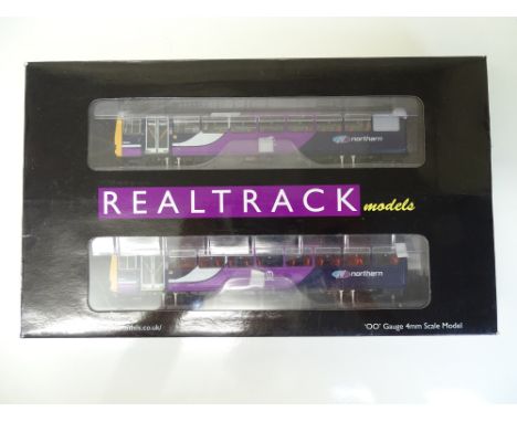 OO SCALE MODEL RAILWAYS: A REALTRACK MODELS RT144-112 Class 144 2-car Pacer DMU numbered 144007 in Northern Night Blue livery