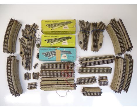 HO SCALE MODEL RAILWAYS: A quantity of MARKLIN 3-rail original M-Track including straights, points, curves etc - G in F/G box