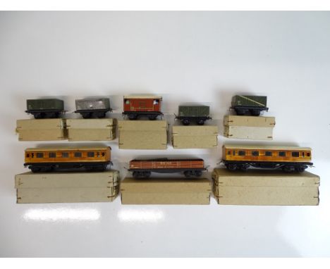 OO SCALE MODEL RAILWAYS: A quantity of boxed wagons and coaches for the TRIX TWIN Railway System - all with pre-war couplings