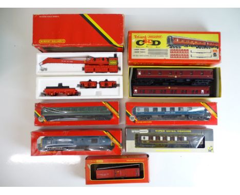 OO SCALE MODEL RAILWAYS: A mixed group of rolling stock to include loco, coaches and wagons by TRI-ANG, HORNBY and WRENN -F/V