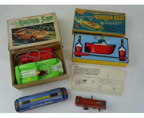 VINTAGE TOYS: A battery operated MARX racing car - together with a WRENN Wonder Boat set and two tinplate toys - G/VG in F/G 