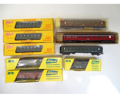 HO SCALE MODEL RAILWAYS: A group of German Outline passenger coaches and wagons by LILIPUT in various liveries - G in G boxes