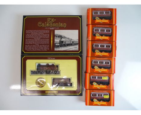 OO SCALE MODEL RAILWAYS: A HORNBY LMS ex-Caledonian 4-2-2 steam loco together with a group of 6 4 wheel Caledonian coaches - 