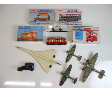 VINTAGE TOYS: A group of kit built aeroplanes, a kit built tram with original box and a selection of unbuilt kits and other i