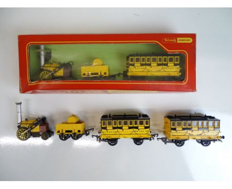OO SCALE MODEL RAILWAYS: A pair of TRI-ANG / HORNBY Rockets comprising an R346 boxed set of Rocket plus one coach together wi