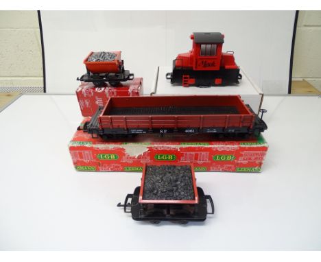 G SCALE MODEL RAILWAYS: A group of LGB items to include two tipper wagons (one unboxed), a bogie gondola car and an LGB compa