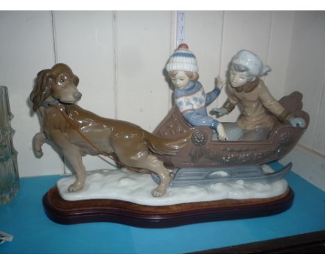 A LLADRO PORCELAIN FIGURE GROUP, Sleigh Ride, No.5037, printed and impressed marks to base, with plinth, length approximately