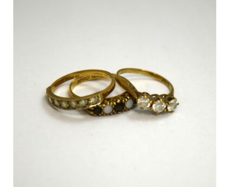 THREE 9CT GOLD GEM SET RINGS, to include an opal and sapphire ring, together with two cubic Zircona rings 