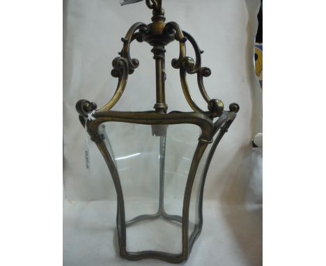 A BRASS MOUNTED GLASS CEILING LIGHT 