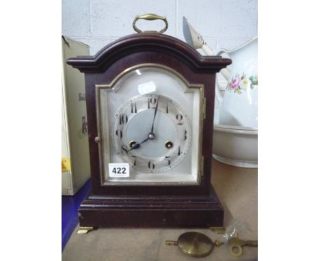 A MANTEL CLOCK, (key and pendulum) 