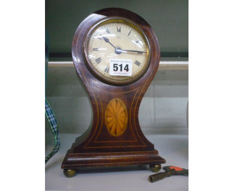 A BALLOON SHAPED MANTEL CLOCK (key) 