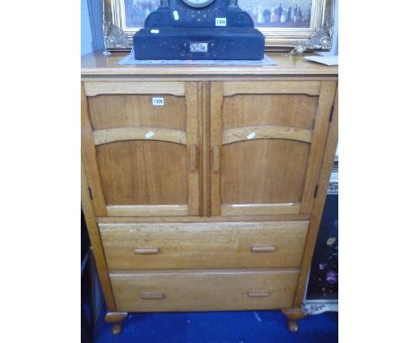 A LIGHT OAK TALLBOY, with two doors above two long drawers on short cabriole supports