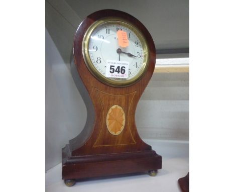 A BALLOON SHAPED MANTLE CLOCK 