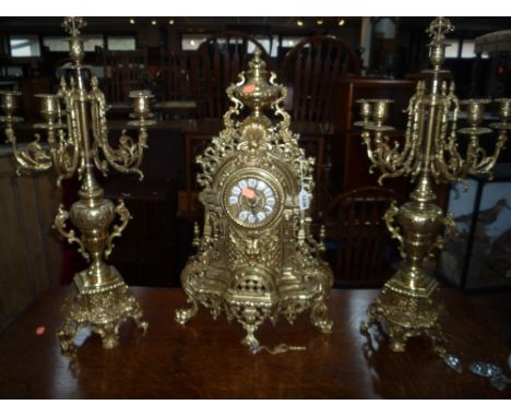 MODERN ORNATE BRASS CLOCK GARNITURE, comprising central clock flanked by a pair of six branch candelabrum (3) (key) 