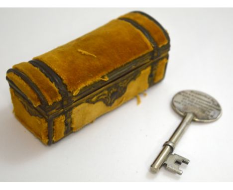 TWO ITEMS, to include a key and a small novelty trunk, key reads 'Presented by ALDE W PARKINSON PRES to Earl of Lanesborough 