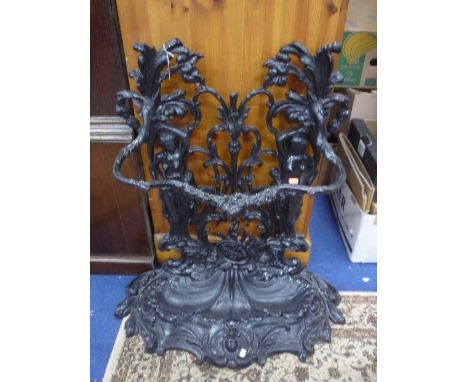 A RECENT BLACK PAINTED CAST IRON STICK STAND, ornately styled with two semi clad maidens