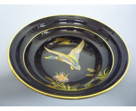 A CARLTONWARE BOWL, painted with Mallard in flight and foliage, diameter approximately 18cm 