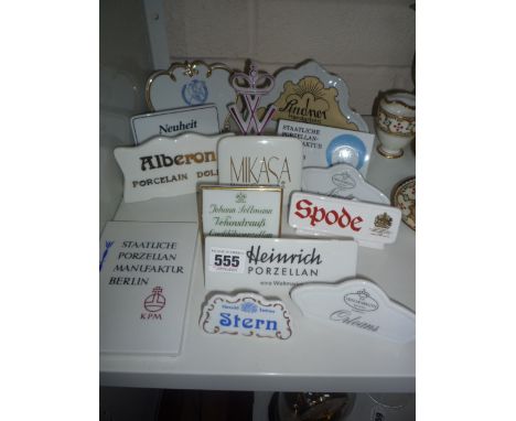 FOURTEEN CERAMIC NAME STANDS, to include 'Spode', 'Lindner', 'KPM', 'Stern' etc     