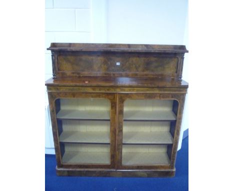 A 19TH CENTURY WALNUT GLAZED TWO DOOR BOOKCASE/DISPLAY CABINET, the raised back with shelf supported on twin turned columns, 