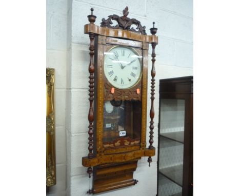 A 19TH CENTURY WALNUT INLAID WALL CLOCK, (key & pendulum)