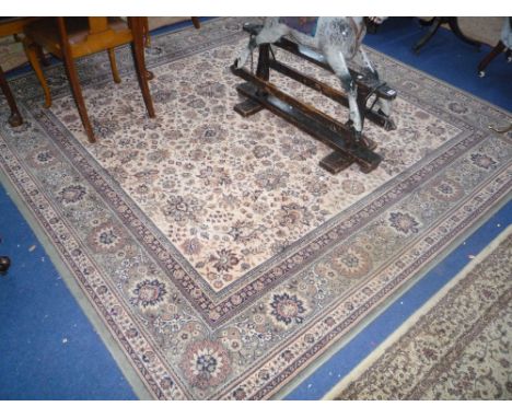 GREEN AND CREAM GROUND FLORAL DESIGN WOOL CARPET, Kashmir G H Frith label attached, approximate size 240cm x 240cm 