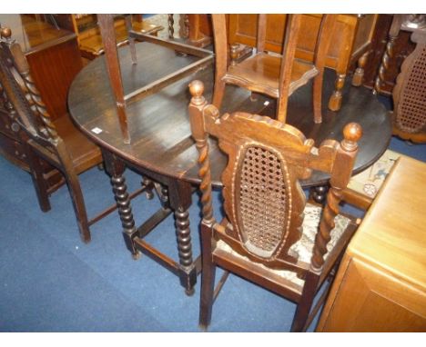 OAK GATE LEG TABLE, with bobbin turned supports and four oak dining chairs with barley twist and detail and canework backs (5