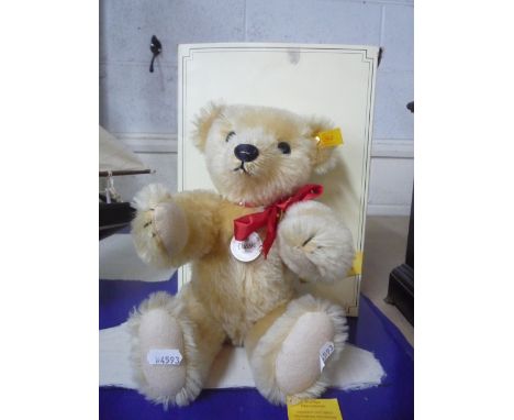 A BOXED STEIFF '1909 CLASSIC 'MOHAIR, TEDDY BEAR, jointed limbs and growler with original label, length approximately 33cm 