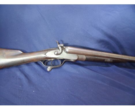Barratt 12 bore side by side hammer gun with 29inch Damacus barrels and under lever opening (stock cracked), serial no. 8868 