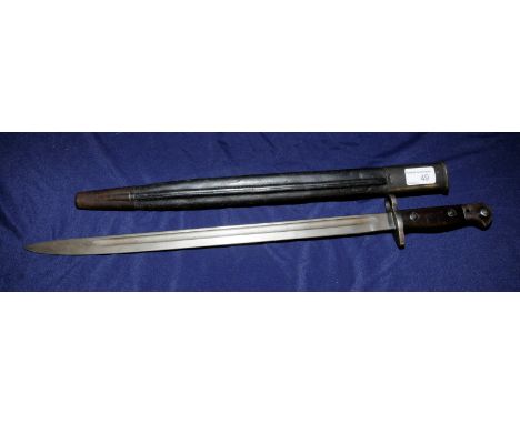 British Remmington bayonet with 17inch single fullered blade and two piece wooden grip complete with leather & metal mounted 