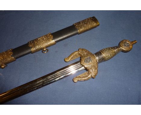 Reproduction Indian straight edged sword with elaborate brass and white metal hilt and guard depicting mythical creatures wit
