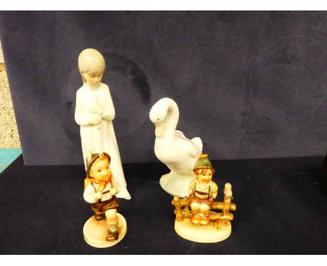 A Nao duck and girl in nightdress and two Hummel children