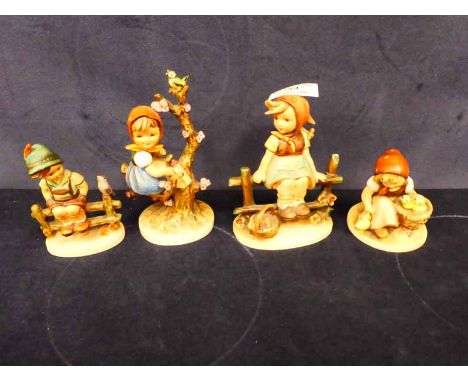 Four Hummel pottery models of children
