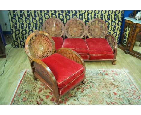 A 1930s walnut veneered bentwood bergére suite including a three seat sofa and single chair with feather cushions 