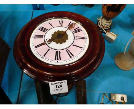 A postmans alarm wall clock, mahogany circular dial with pink and white enamel dial, 