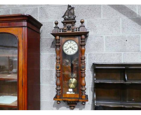 A Vienna style walnut cased twin weight wall clock 