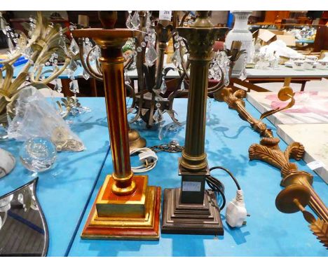 Two Corinthian column table lamp bases, one brass, one wooden.