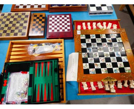 Two backgammon sets, Chinese chess set and three other chess sets 