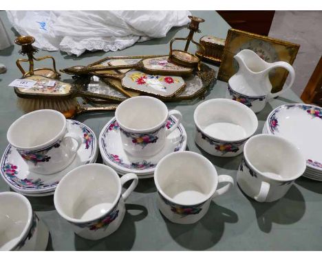 A Royal Doulton autumns glory twenty piece tea service and twelve items of gilt dressing table accessories including clock, c