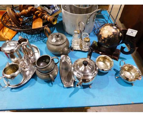 A Pewter three piece tea set, another on an oval tray, a plated three piece Bachelor service, a cruet set and a modern tinpla