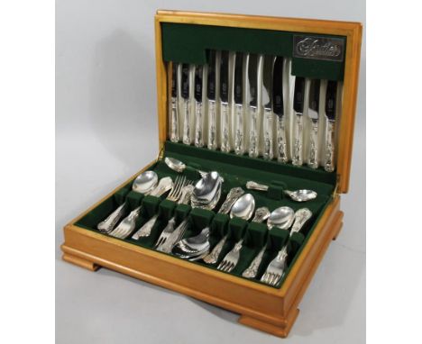 A George Butler Sheffield part canteen of silver plated cutlery, shell capped Kings pattern, part settings for six, in a yew 