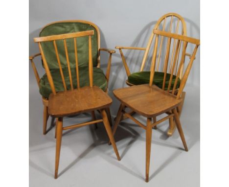 A collection of Ercol furniture, to include two kitchen chairs, an open armchair, and a kitchen armchair. 