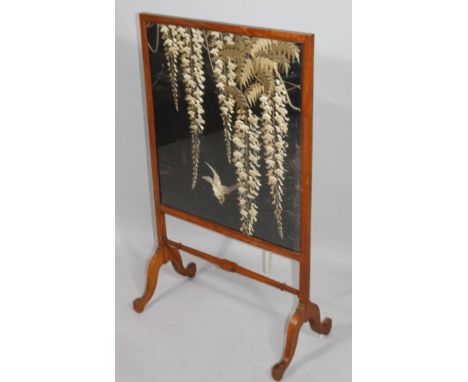 A 20thC firescreen, with an embroidered rectangular centre, joined by a horizontal stretcher, 83cm high, 75cm wide, 30cm deep