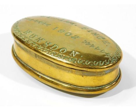 An Edwardian brass snuff box, with oval outline the hinged lid marked William.Finch.1902, HUNSDON,  with plain interior on ov